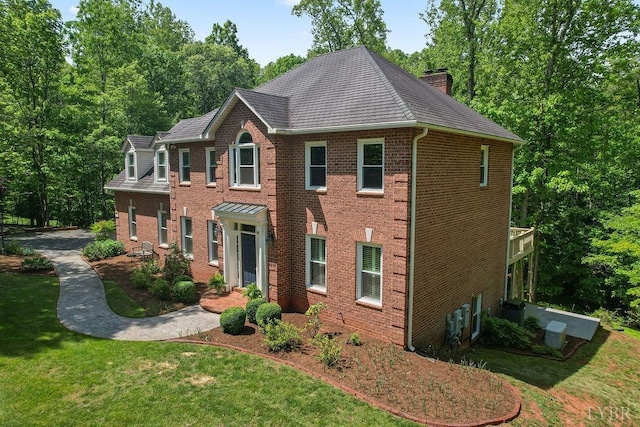 4936 Mountain Laurel Dr, Lynchburg, VA 24503 - colonial-style house featuring a front lawn, brick siding, a chimney, and a shingled roof