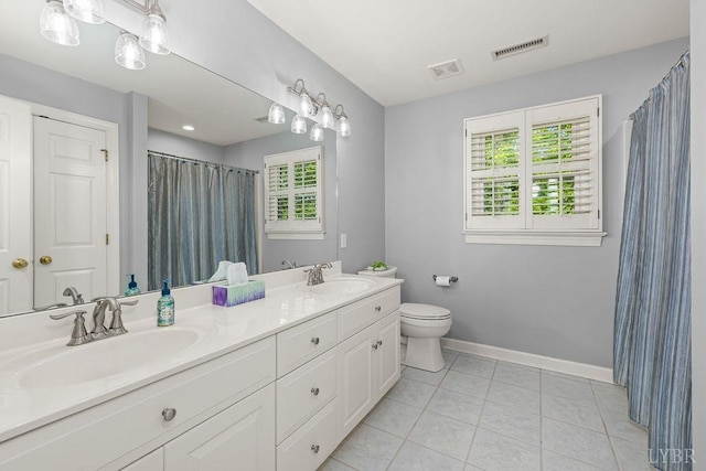 4936 Mountain Laurel Dr, Lynchburg, VA 24503 - bathroom featuring double vanity, baseboards, healthy amount of natural light, and toilet
