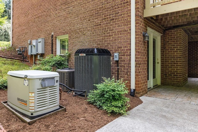 4936 Mountain Laurel Dr, Lynchburg, VA 24503 - exterior view of a power unit, central air condition unit, and brick siding