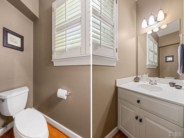 4936 Mountain Laurel Dr, Lynchburg, VA 24503 - bathroom featuring toilet, vanity, baseboards, and wood finished floors