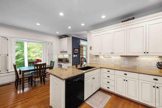 4936 Mountain Laurel Dr, Lynchburg, VA 24503 - kitchen with dishwasher, a sink, crown molding, decorative backsplash, and white cabinets