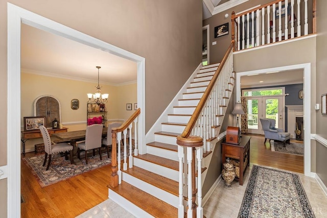 4936 Mountain Laurel Dr, Lynchburg, VA 24503 - staircase with a chandelier, ornamental molding, wood finished floors, french doors, and a high ceiling