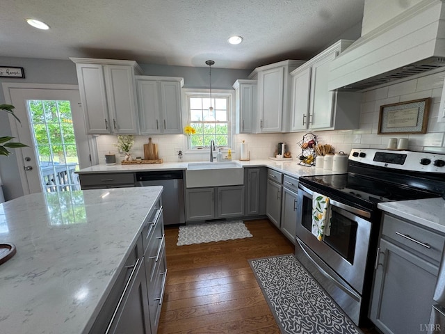 605 Beeks Ln, Spout Spring, VA 24593 - kitchen with appliances with stainless steel finishes, custom range hood, gray cabinetry, a sink, and healthy amount of natural light