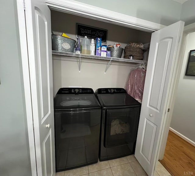 605 Beeks Ln, Spout Spring, VA 24593 - laundry area featuring separate washer and dryer, light tile patterned floors, and baseboards