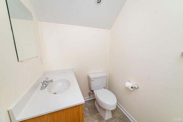 126 Golf Course Trl, Amherst, VA 24521 - half bathroom with vanity, lofted ceiling, and stone finish floors