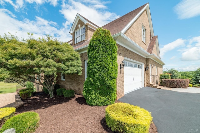 126 Golf Course Trl, Amherst, VA 24521 - view of home's exterior with asphalt driveway, brick siding, and a garage