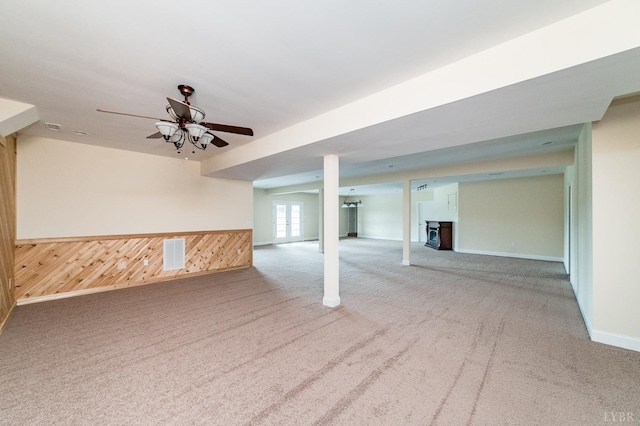 126 Golf Course Trl, Amherst, VA 24521 - basement with carpet, ceiling fan, wood walls, and baseboards