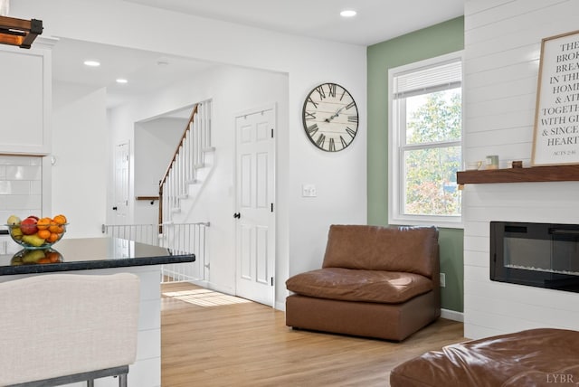 71 Patrick Ct, Madison Heights, VA 24572 - living room with light wood-style flooring, recessed lighting, a fireplace, and stairs
