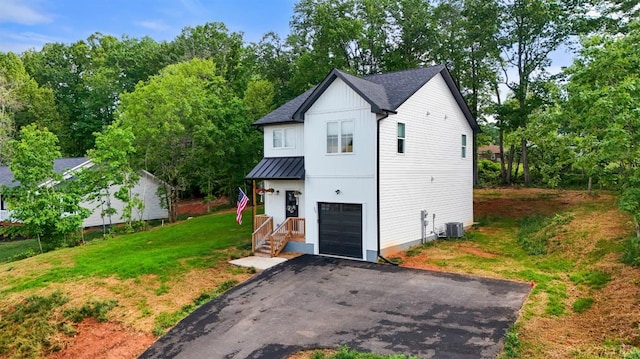 71 Patrick Ct, Madison Heights, VA 24572 - modern farmhouse with a standing seam roof, metal roof, a front lawn, asphalt driveway, and an attached garage