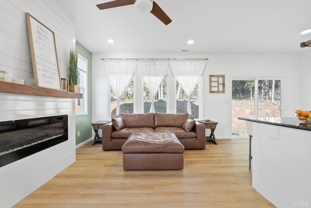 71 Patrick Ct, Madison Heights, VA 24572 - living room featuring a ceiling fan, light wood-style floors, recessed lighting, a fireplace, and baseboards