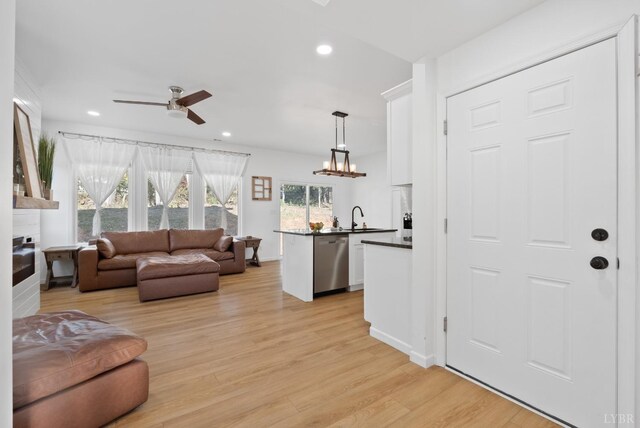 71 Patrick Ct, Madison Heights, VA 24572 - living area featuring ceiling fan, light wood-style floors, recessed lighting, a large fireplace, and a chandelier