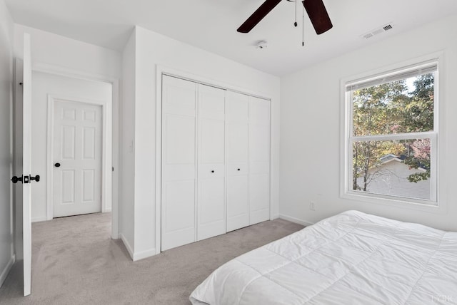 71 Patrick Ct, Madison Heights, VA 24572 - bedroom with light colored carpet, a closet, baseboards, and a ceiling fan