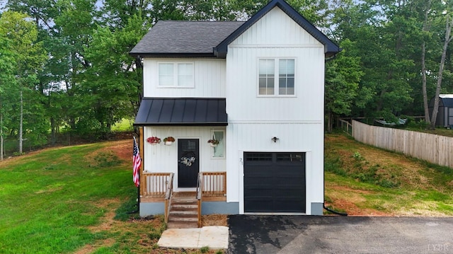 71 Patrick Ct, Madison Heights, VA 24572 - modern farmhouse with a standing seam roof, a garage, driveway, roof with shingles, and metal roof