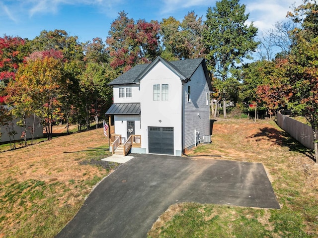 71 Patrick Ct, Madison Heights, VA 24572 - view of front of home featuring driveway, a standing seam roof, an attached garage, central air condition unit, and metal roof