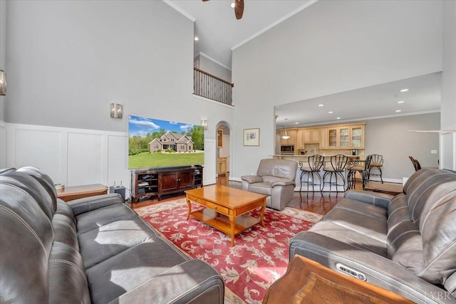 1037 Deer Hollow Rd, Forest, VA 24551 - living area with crown molding, arched walkways, a high ceiling, light wood-type flooring, and ceiling fan