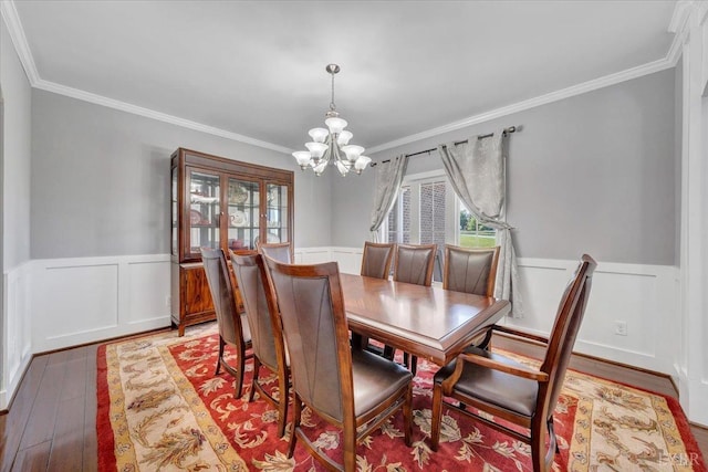 1037 Deer Hollow Rd, Forest, VA 24551 - dining area featuring a chandelier, crown molding, wainscoting, and light wood-style flooring