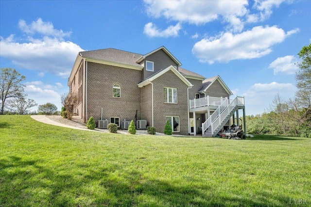 1037 Deer Hollow Rd, Forest, VA 24551 - rear view of house with stairs, central air condition unit, a wooden deck, brick siding, and a yard