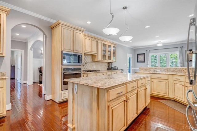 1037 Deer Hollow Rd, Forest, VA 24551 - kitchen with appliances with stainless steel finishes, light brown cabinetry, ornamental molding, arched walkways, and wood-type flooring