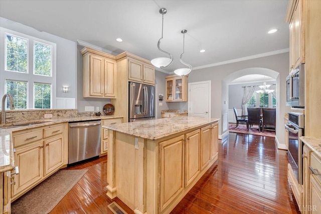 1037 Deer Hollow Rd, Forest, VA 24551 - kitchen featuring stainless steel appliances, a sink, arched walkways, a center island, and light brown cabinetry