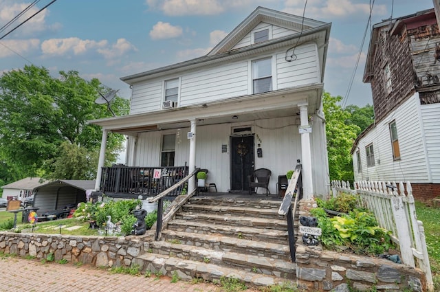 1706 Union St, Lynchburg, VA 24504 - american foursquare style home featuring covered porch, a carport, and fence
