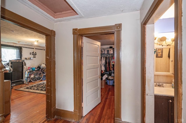 1706 Union St, Lynchburg, VA 24504 - corridor with wood-type flooring, a sink, and a textured ceiling