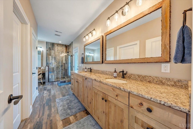 20438 Wyatts Way, Evington, VA 24550 - full bathroom featuring a shower stall, wood finished floors, double vanity, and recessed lighting
