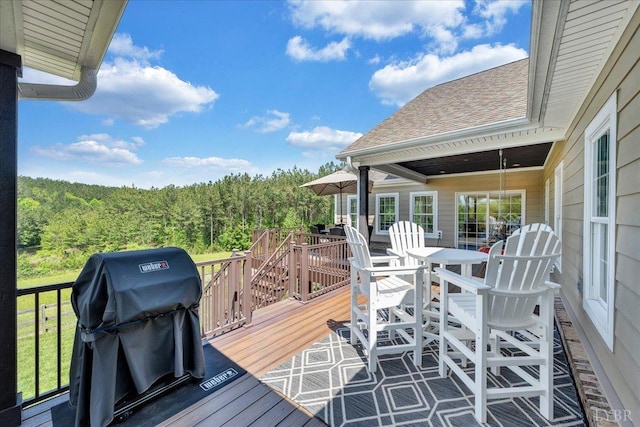 20438 Wyatts Way, Evington, VA 24550 - wooden deck with a grill, a view of trees, and outdoor dining space