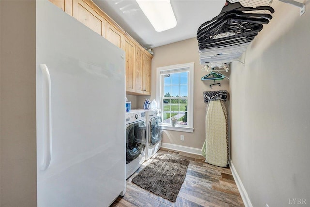 20438 Wyatts Way, Evington, VA 24550 - clothes washing area with cabinet space, separate washer and dryer, wood finished floors, and baseboards