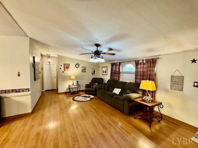 3164 Trent Hatchery Rd, Appomattox, VA 24522 - living area with a ceiling fan, wood finished floors, and a textured ceiling