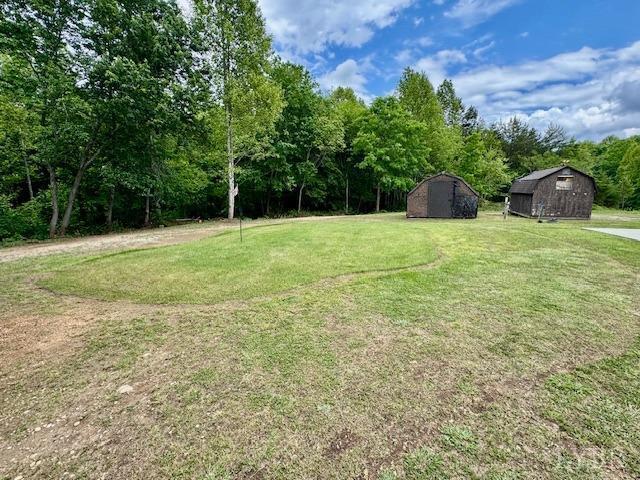 3164 Trent Hatchery Rd, Appomattox, VA 24522 - view of grassy yard with a storage shed and an outbuilding