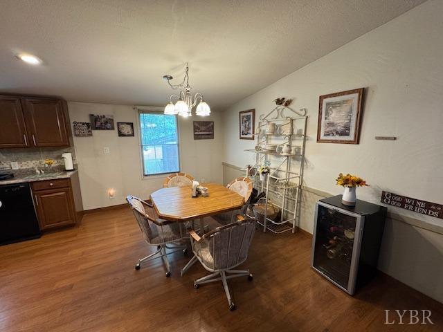 3164 Trent Hatchery Rd, Appomattox, VA 24522 - dining area featuring dark wood-type flooring, a chandelier, and baseboards
