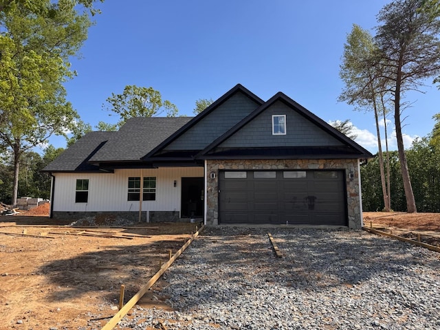 234 Thistle Rd, Rustburg, VA 24588 - view of front facade with dirt driveway, a garage, and a shingled roof