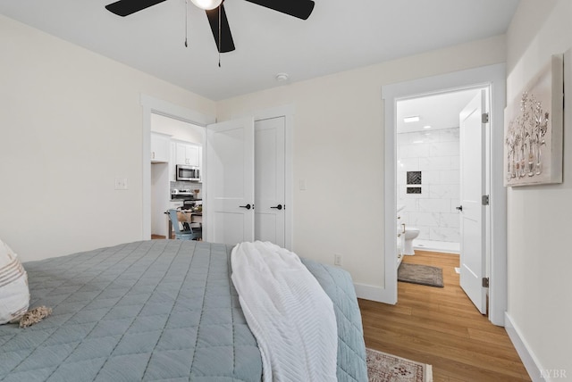 7942 Bear Creek Rd, Gladys, VA 24554 - bedroom with light wood-style flooring, a closet, a ceiling fan, ensuite bath, and baseboards