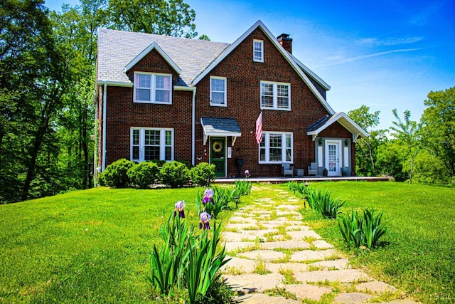 39 N Princeton, Lynchburg, VA 24503 - view of front of home featuring a chimney, a front yard, and brick siding