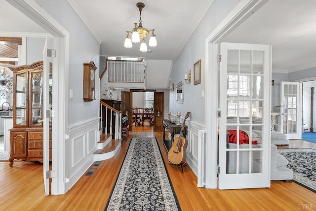 39 N Princeton, Lynchburg, VA 24503 - entrance foyer with a chandelier, ornamental molding, wood finished floors, stairway, and a decorative wall