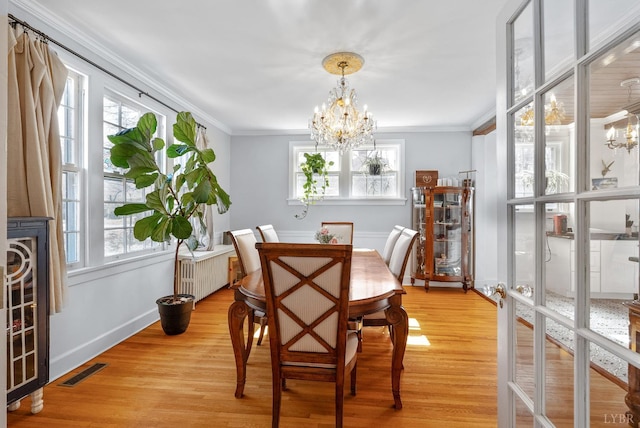 39 N Princeton, Lynchburg, VA 24503 - dining space featuring a chandelier, healthy amount of natural light, radiator heating unit, and crown molding