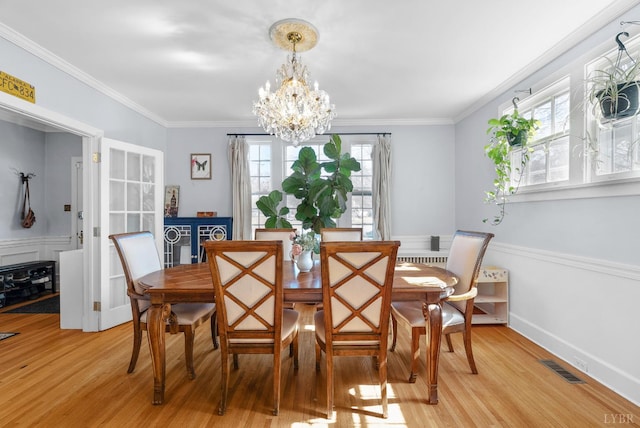 39 N Princeton, Lynchburg, VA 24503 - dining space featuring light wood-type flooring, a chandelier, and ornamental molding