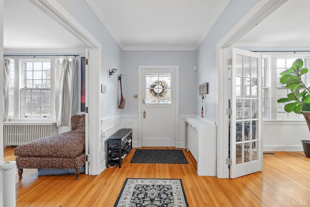 39 N Princeton, Lynchburg, VA 24503 - entrance foyer with radiator heating unit, plenty of natural light, wood finished floors, a wainscoted wall, and crown molding