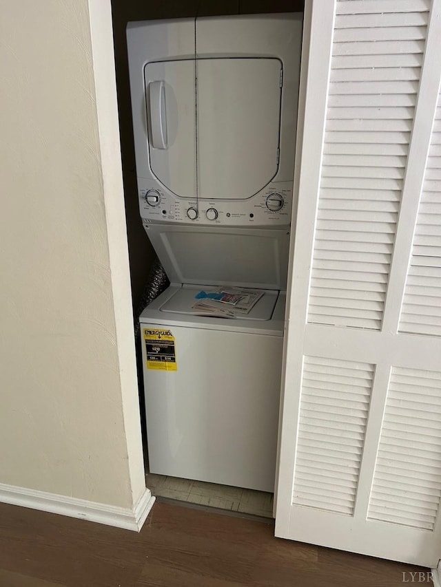 3101 Link Rd Unit 68, Lynchburg, VA 24503 - laundry room with stacked washer and clothes dryer, wood finished floors, and baseboards