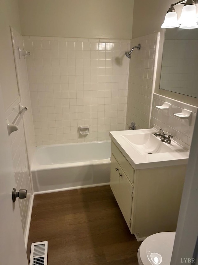 3101 Link Rd Unit 68, Lynchburg, VA 24503 - full bath with wood finished floors, washtub / shower combination, vanity, and toilet