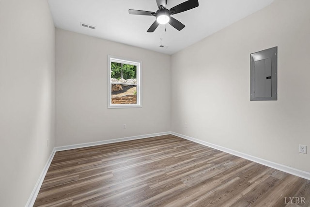 2127 Elm St, Lynchburg, VA 24504 - spare room featuring electric panel, wood finished floors, and baseboards