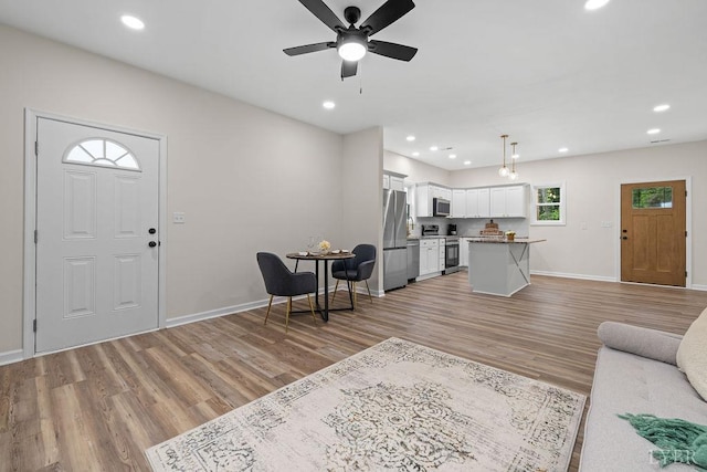 2127 Elm St, Lynchburg, VA 24504 - living area with light wood-style floors, baseboards, ceiling fan, and recessed lighting