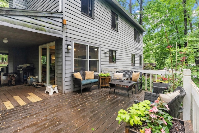 wooden deck with grilling area, cooling unit, and outdoor lounge area