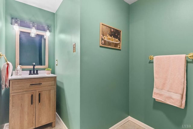 bathroom featuring vanity and baseboards