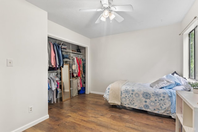 bedroom with wood finished floors, baseboards, a closet, and a ceiling fan
