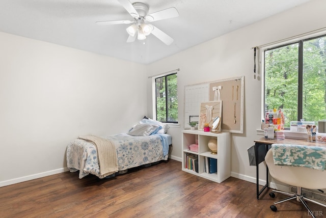 bedroom with wood finished floors, baseboards, and ceiling fan
