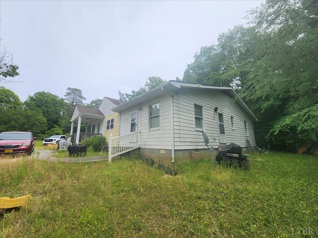 view of property exterior with crawl space