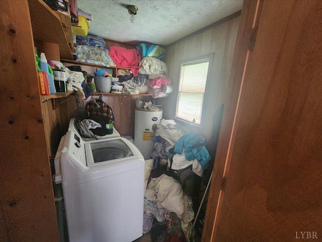 clothes washing area with water heater and washer / clothes dryer