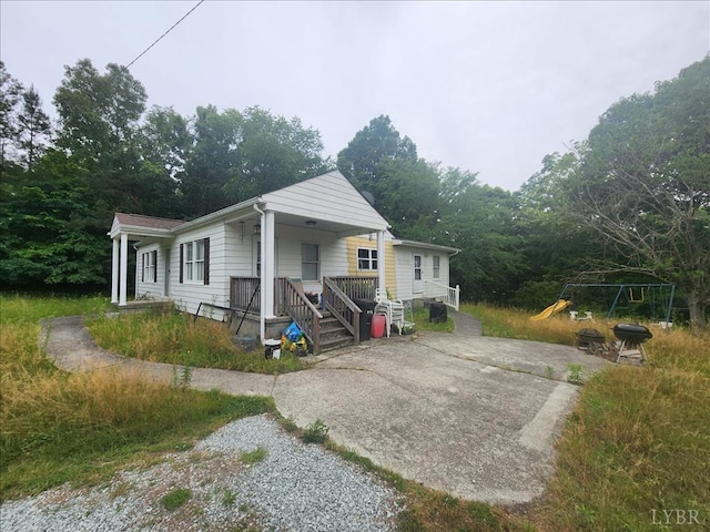view of side of property featuring a porch