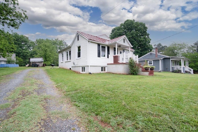 1920 Roxbury St, Lynchburg, VA 24501 - view of front facade with driveway, a front lawn, a standing seam roof, and a metal roof